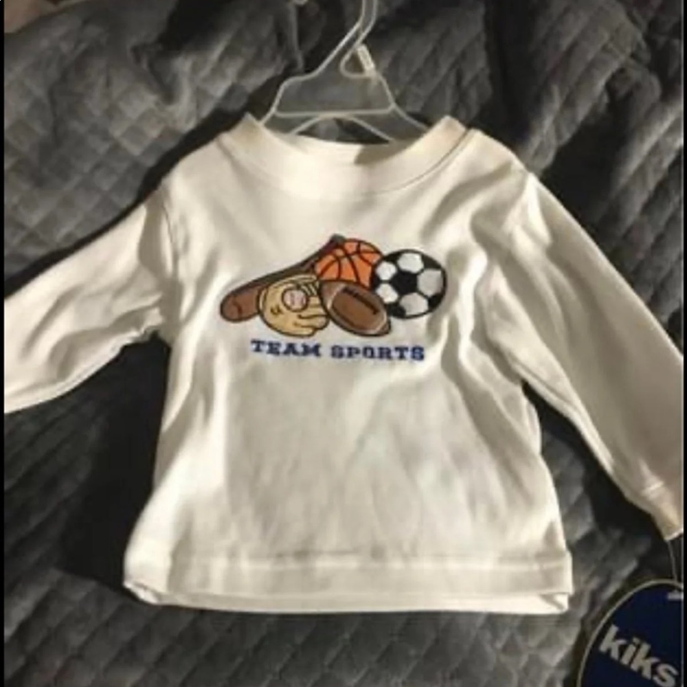 Long sleeve shirt with team sports and balls.12m